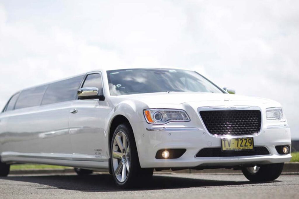 Chrysler 300C Super Stretch white limousine on the road