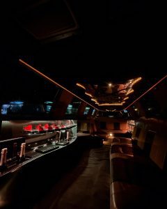 Luxurious limousine interior with leather seats and champagne bottles
