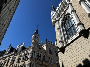 Neo-Gothic architecture under a clear blue sky in Riga's Old Town