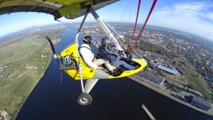 Scenic ultralight flight over the Daugava River in Riga, Latvia