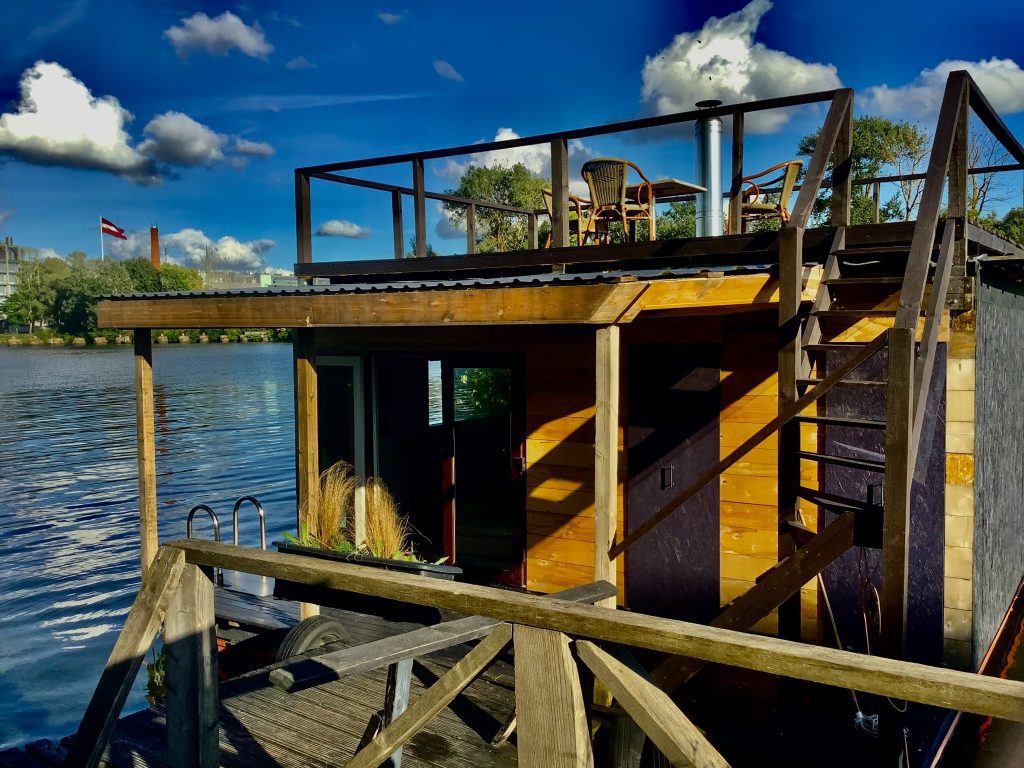 Floating sauna cabin on the Daugava River with rooftop seating