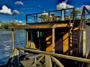 Floating sauna cabin on the Daugava River with rooftop seating