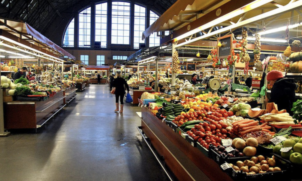 Interior of Riga Central Market pavilion with colorful fruit and vegetable stands