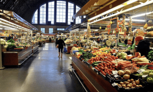 Interior of Riga Central Market pavilion with colorful fruit and vegetable stands
