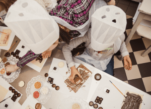 Children making creative chocolate treats during a hands-on workshop.