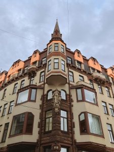 Historic corner building with turret and sculpture in Riga Old Town