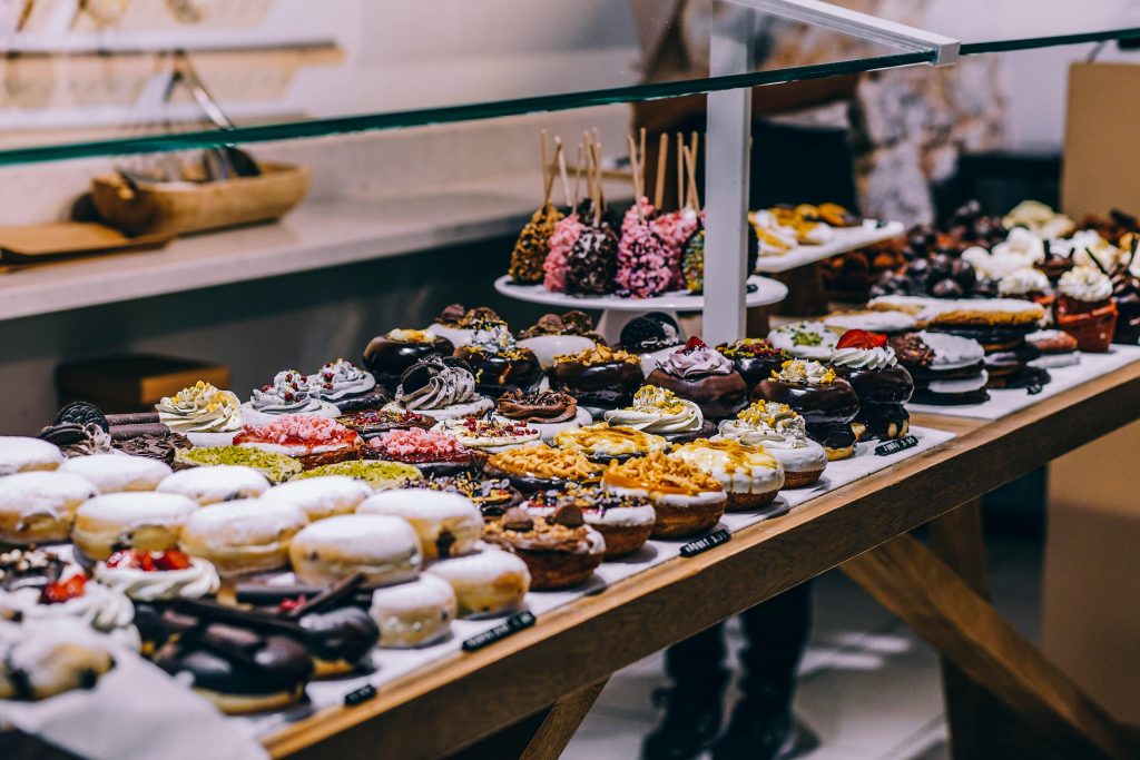 Assorted donuts and sweet pastries on display at Riga’s food market