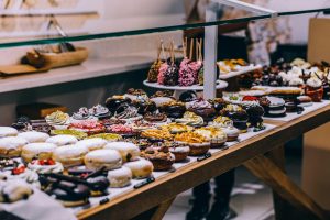 Assorted donuts and sweet pastries on display at Riga’s food market